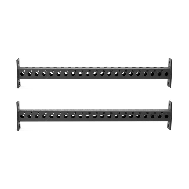 The Bells of Steel Manticore Crossmembers are black metal bars with evenly spaced circular holes and mounting brackets on each end, designed for attaching to 3x3 power rack uprights. Displayed against a white background.