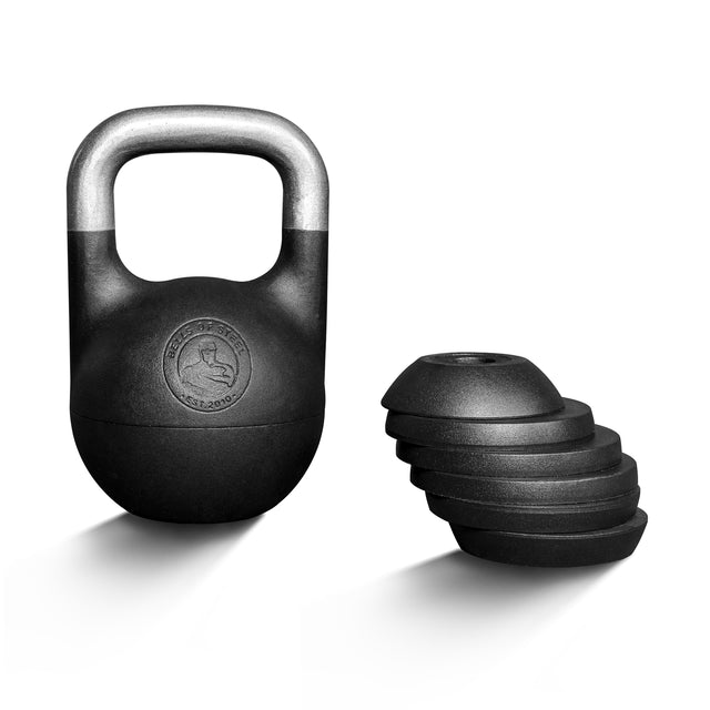 A Bells of Steel 6-12KG Adjustable Kettlebell in black, featuring a competition-style design with a metallic handle, stands upright beside its detachable weight platesâstacked by size on a white backgroundâinspired by Mark Wildmanâs training methods.