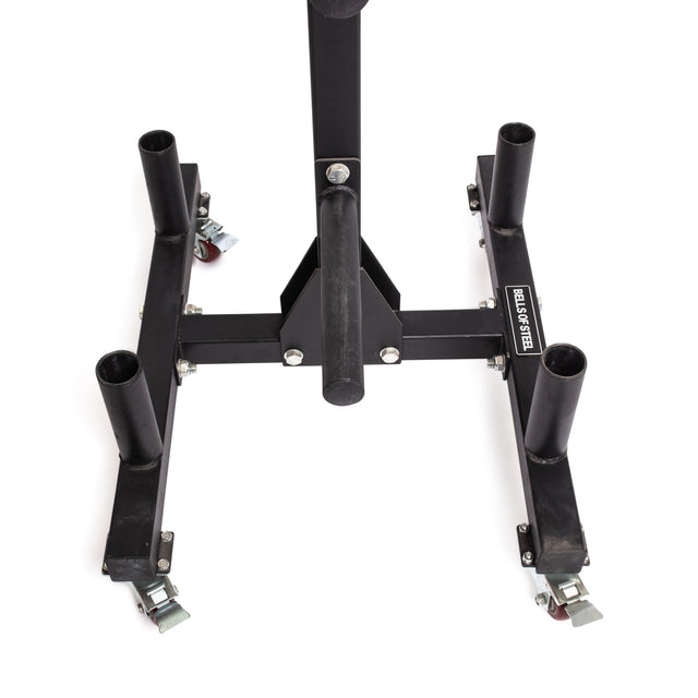 The Bells of Steel Bumper Plate Weight Tree And Bar Holder features four vertical posts for plate storage, caster wheels at each corner, a central handle, and a "BUILD STRENGTH" label on one arm, shown on a white background.