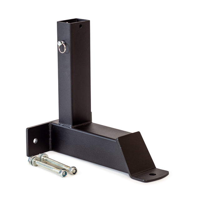 A black metal Bells of Steel Bench Attachments hitch mount bracket, featuring a vertical square tube, horizontal base, clip pin, and two bolts, compatible with leg extension curl attachments for the Buzzsaw Bench. Photographed on white.