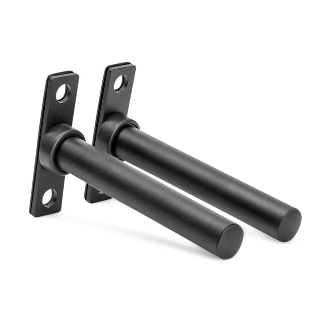 The Bells of Steel Bolt-On Plate Pegs are two black cylindrical wall-mounted brackets with rectangular bases, each base has two mounting holes. The parallel pegs are ideal for supporting shelves or holding Olympic weight plates.