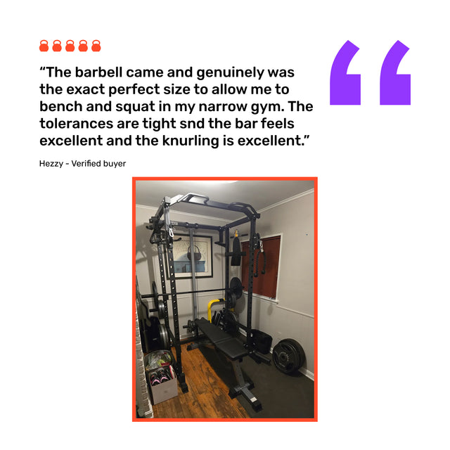 A review praises the Bells of Steel Short Rackable Barbell for its compact size and knurling, shown in a photo with a power rack, weight plates, utility bar, and other gym gear arranged on wood flooring in a small home gym.
