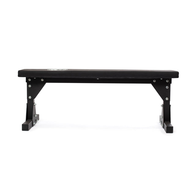 The Bells of Steel Flat Utility Bench features a sturdy padded top and strong metal legs, shown in black from the front against a white background.