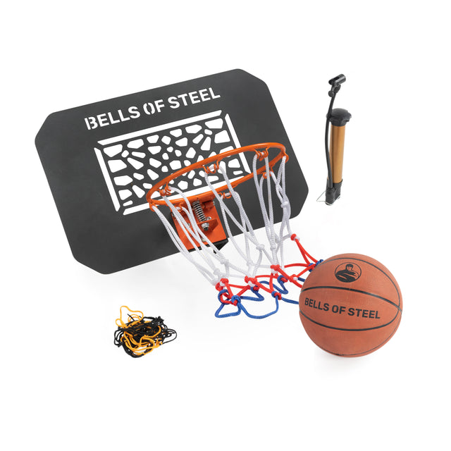 The Bells of Steel Rack Attached Basketball Hoop w/ Ball features a black backboard, orange rim, red/white/blue net, brown basketball, black and gold hand pump, plus extra chains and net—perfect for your home gym.