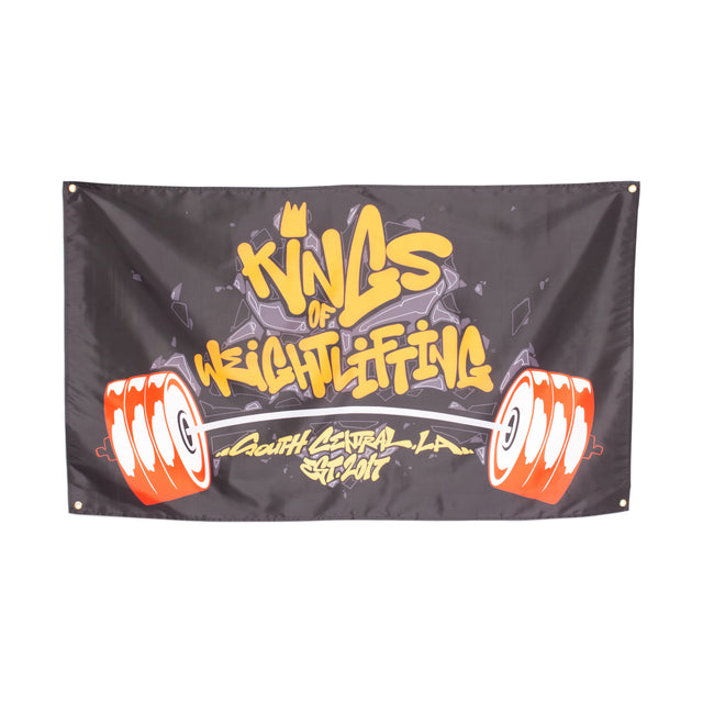 The Bells of Steel Flags feature a black background with graffiti-style yellow and white "Kings of Weightlifting" and "South Central LA Est. 2017" text, plus red and white barbells—a bold home gym flag for standout gym decor.