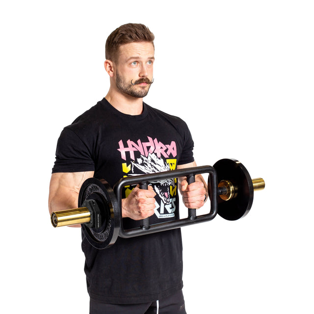 A man with a mustache, in a black graphic tee and pants, lifts a barbell with round weights secured by Bells of Steel Magnetic Clamp Collars against a white background.