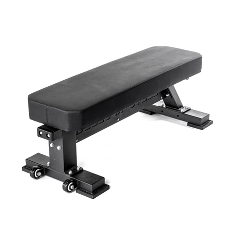 A black, padded flat weight bench with sturdy metal legs and small wheels on one end for easy movement, placed against a plain white background.