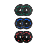 Six black Bells of Steel Dead Bounce Conflict Bumper Plate pairs—green 10kg, blue 20kg, red 25kg—each with a center hole and dead bounce for safer lifts.
