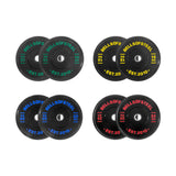 The Dead Bounce Conflict Bumper Plate Sets by Bells of Steel include four pairs of black plates (10 kg green, 15 kg yellow, 20 kg blue, 25 kg red) labeled with “BELLS OF STEEL EST. 2010” and made from virgin rubber for a dead bounce.