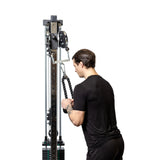 male athlete using the 2 to 1 Cable Attachment Adapter on a cable machine