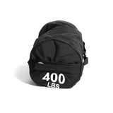 A Bells of Steel Fitness Sandbag, black and cylindrical with "400 LBS" in bold white print on the end, showcases durable construction as it rests on its side against a plain white background.
