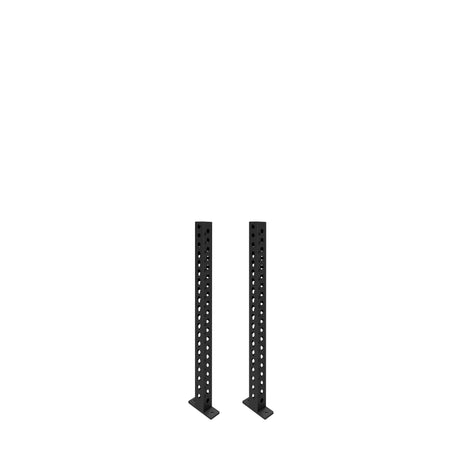 Two black Manticore Vertical Uprights by Bells of Steel, each 3x3 with evenly spaced holes, stand on flat rectangular bases—perfect for diverse rack attachments—against a white background.