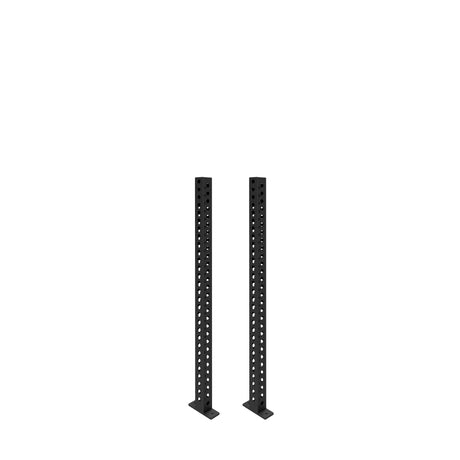 Two black metal Manticore Vertical Uprights by Bells of Steel, featuring evenly spaced holes, stand upright on flat rectangular bases, ready for rack attachments, set against a white background.