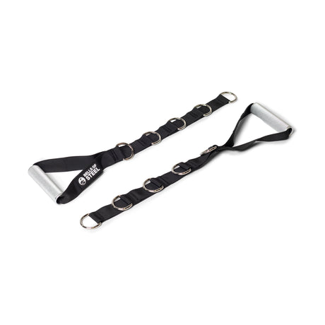Two black adjustable straps with multiple metal D-rings and cushioned aluminum handles from Bells of Steel’s Aluminum Handles Pair, designed for exercise or cable machines, are laid out on a white background. One strap shows the "Sheer Steel" logo.