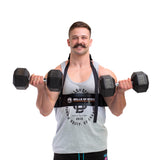 A man with a mustache in a gray tank top uses the Bells of Steel Arm Blaster to perform bicep curls with two black dumbbells, standing against a white background.
