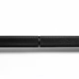 A close-up of the Bells of Steel Powerlifting Bar’s textured black metal finish and center knurling detail, meeting IPF specs, shown against a white background at the intersection of two bar sections.