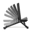 Side view of the Buzz-Saw Heavy-Duty Adjustable Bench by Bells of Steel, featuring premium vinyl upholstery and multiple backrest angles from flat to upright for stability. The black bench is displayed on a white background.