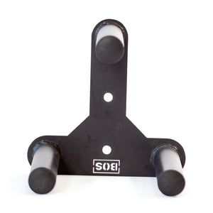 The Bells of Steel Change Plate Storage Pegs is a black metal wall mount rack with three horizontal pegs in a triangular layout for Olympic change plates, two mounting bolt holes, and a white "SIS" logo at the base.