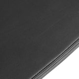 Close-up of a dark grey fabric surface resembling the Bells of Steel Flat/Incline/Decline Weight Bench, showcasing textured upholstery with a seam and visible stitching.