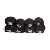 Seven Bells of Steel Fitness Sandbags, featuring durable Condura construction and white weight labels from 50 to 400 lbs, are arranged on a white background—ideal for intense sandbag workouts.