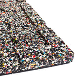 Close-up of the Bells of Steel Rubber Flooring Gym Mat 39" x 39" with a speckled, textured surface in black, white, red, yellow, blue, and green—made from recycled materials for excellent sound dampening.