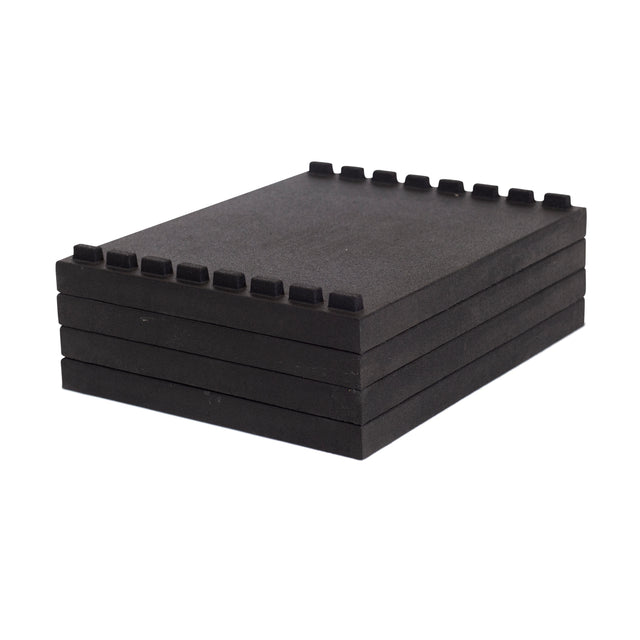 A set of five Bells of Steel Stackable Pull Blocks, rectangular and black with interlocking notches, is arranged neatly on a white background.