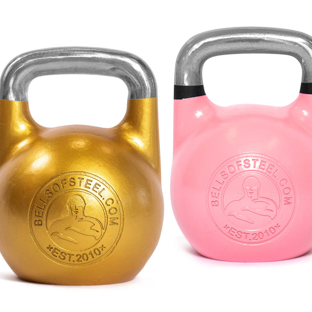 Two Bells of Steel Competition Kettlebells sit side by side: gold with a silver handle on the left, pink with a black stripe on the right. Both are ergonomically designed and feature "bellsofsteel.com" with logo—perfect for sport enthusiasts.
