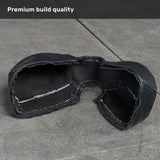 A Bells of Steel Kettlebell Wrap in black, featuring visible stitching and a breathable mesh interior for style and floor protection, rests on a gray stone surface. The corner caption reads, “Premium build quality.”.