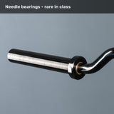 A close-up of the Bells of Steel Safety Squat Bar – The SS4 sleeve with a smooth metal finish highlights its needle bearing system. "Needle bearings—rare in class" is written above, perfect for your leg day training.