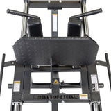 A close-up of the Bells of Steel Leg Press Hack Squat Machine shows a textured footplate, cushioned shoulder pads, and warning labels—making it a versatile choice for any home gym.
