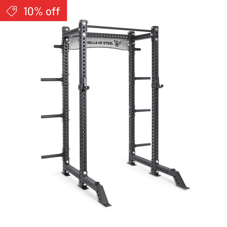 The Bells of Steel Manticore Collegiate Power Rack Builder (3" x 3", 1" holes) in black steel features versatile attachment options and a red "10% off" tag—an ideal upgrade for any home gym rack setup.