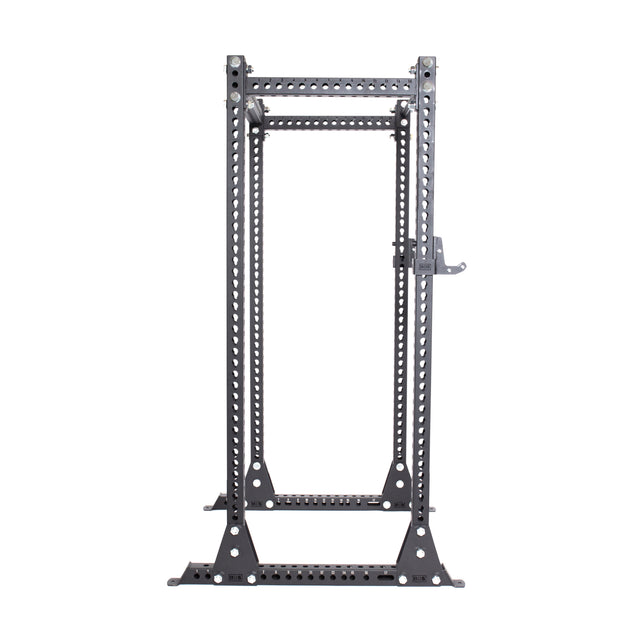 The Manticore Flat Foot Power Rack - Prebuilt by Bells of Steel is a robust black metal structure with adjustable J-hooks, modular parts, and numerous holes for customization. Its 1,000-pound capacity makes it ideal for strength training exercises like squats and bench presses.