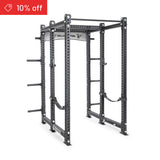 The Bells of Steel Manticore Six Post Power Rack Builder features 3" x 3" uprights, 1" holes for attachments, plate storage pegs, safety straps, and pull-up bars. A red banner in the top left shows "10% off.