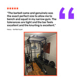 A review praises the Bells of Steel Short Rackable Barbell for its compact size and knurling, shown in a photo with a power rack, weight plates, utility bar, and other gym gear arranged on wood flooring in a small home gym.