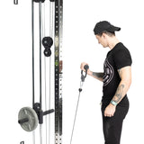 Wearing black athletic gear and a cap, a person uses the Bells of Steel Fat Bar - Single D Handle on a cable pulley machine, gripping the thick handle with one hand to boost grip strength while standing beside the weighted frame.