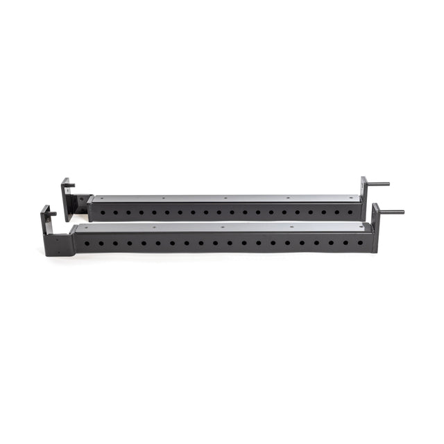 A pair of Bells of Steel Flip-Down Safeties, black metal brackets with multiple holes for adjustable mounting in a power rack, are shown parallel on a white background.