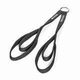 The Bells of Steel RocIT Tricep Strap is a pair of black climbing slings linked by a metal ring, used as stirrups or aiders for rope climbs or rescues, and resembles a cable machine attachment. Shown on a white background.