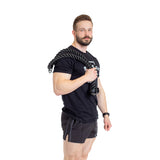 A man in a black t-shirt and shorts holds the Bells of Steel Extra Long Tricep Rope Extension (137cm) draped over his shoulder against a white background.