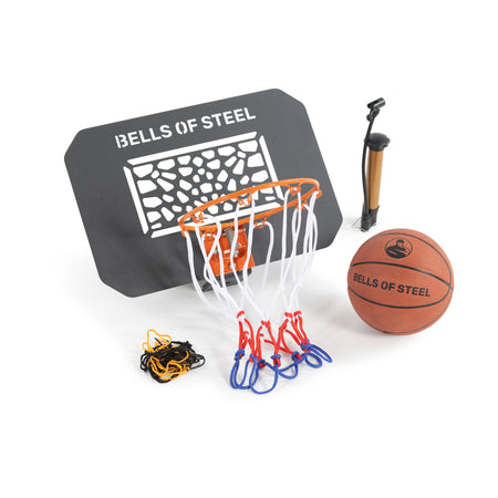 The Bells of Steel Rack Attached Basketball Hoop w/ Ball features a black branded backboard, orange and white rim, brown basketball, hand pump, and chain net—ideal for home gyms or as a power rack basketball accessory.