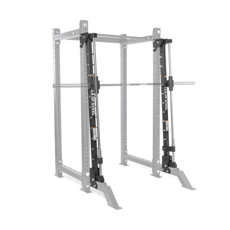 The Bells of Steel Smith Machine Rack Attachment, in silver and black, is mounted on a gray power rack frame. Its barbell glides smoothly along vertical guide rails for safe, controlled lifting within the Smith machine structure.