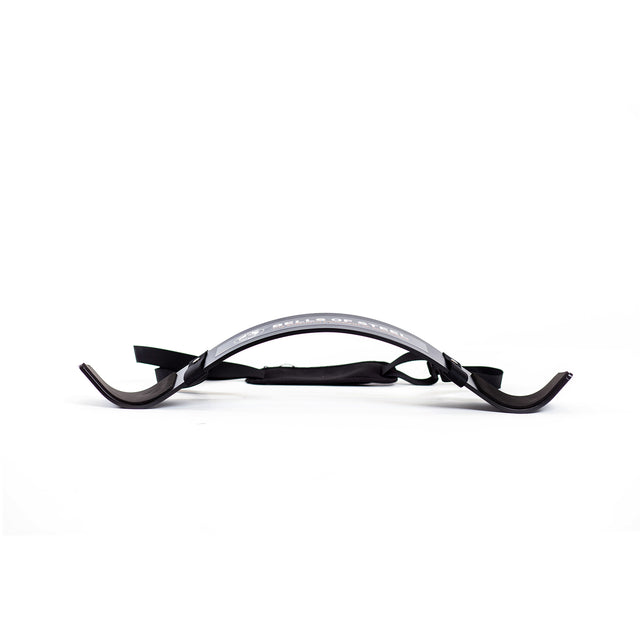 The Bells of Steel Arm Blaster is a black, curved plastic support with dual-end hooks and an adjustable strap, ideal for bicep curls or tricep pushdowns, shown on a white background.